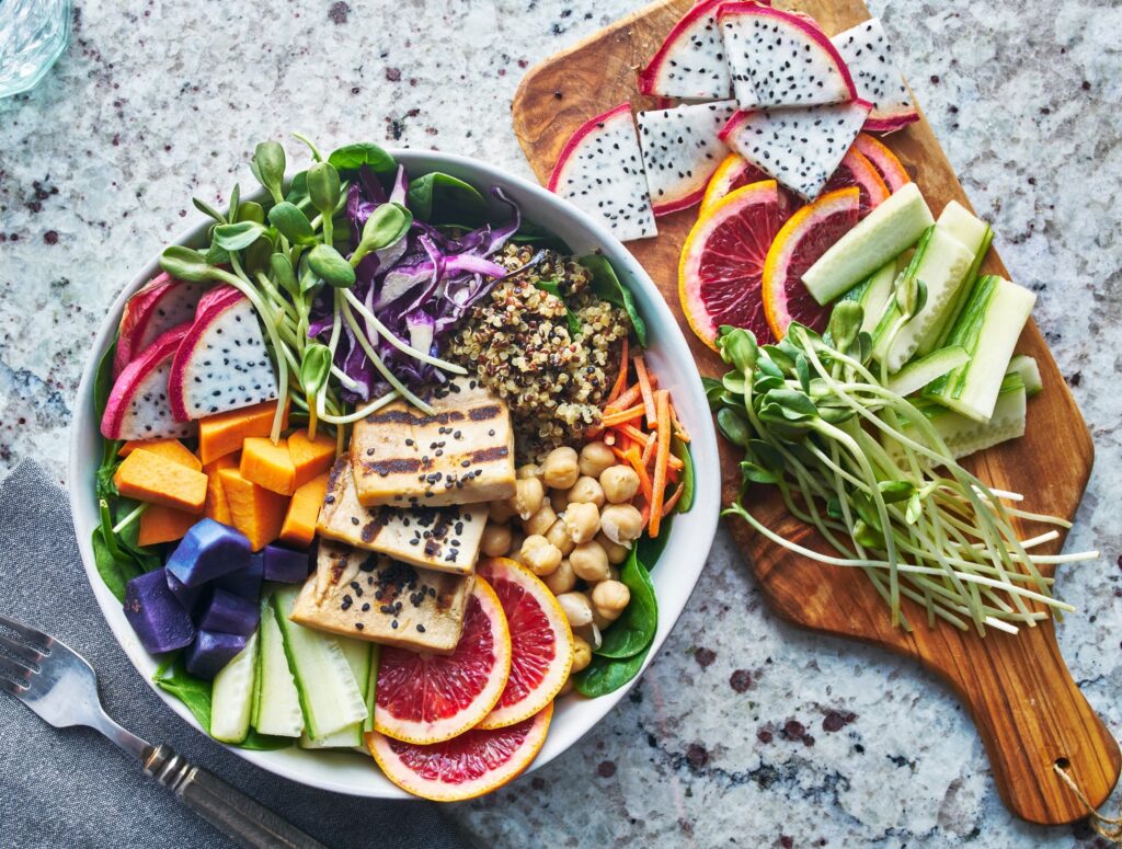 Plant-based spread on cutting board and in bowl on counter